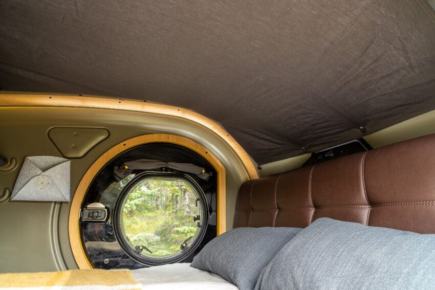 Whether you're a couple, a small family, or traveling with furry friends, the MINK-E has you covered with its versatile canvas bunk bed that can be adjusted or removed to create more space for your belongings.