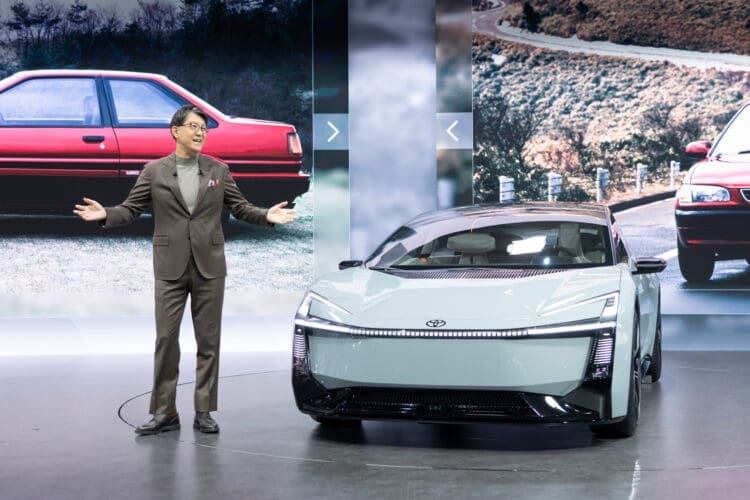 Toyota president Koji Sato with the toyota corolla concept