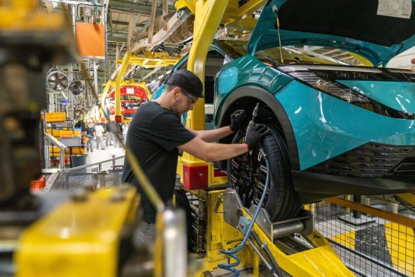 A wheel being fit to a Nissan LEAF